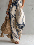 Mono de corte ancho con cuello halter, estampado difuminado y bolsillos