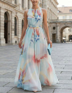 Blue Background With Iridescent Floral Halter Neck And Cinched Waist Maxi Dress