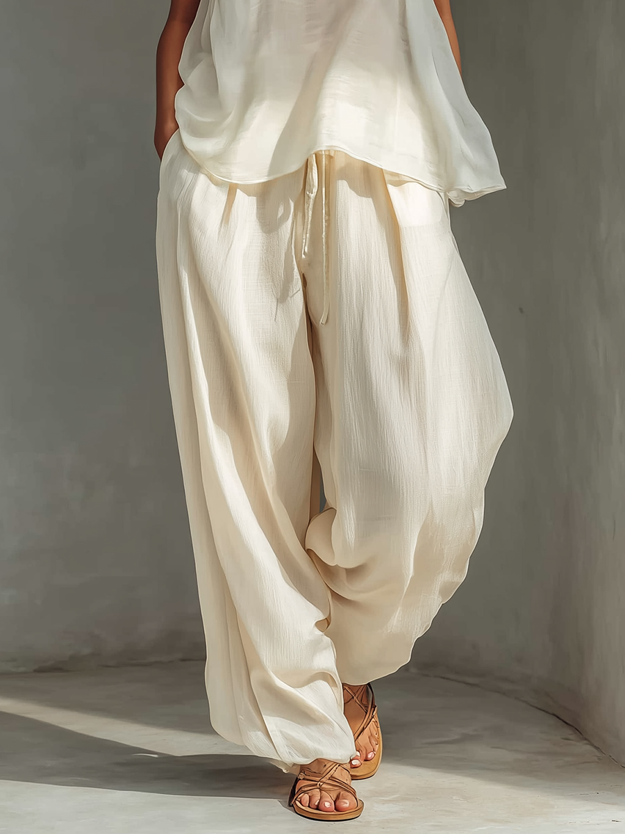 Pantalón ancho crema de tencel con cordón y bolsillos