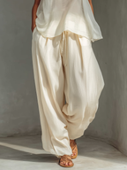 Pantalón ancho crema de tencel con cordón y bolsillos