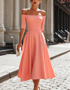 Abito midi color rosa corallo con spalle scoperte e maniche a tre quarti