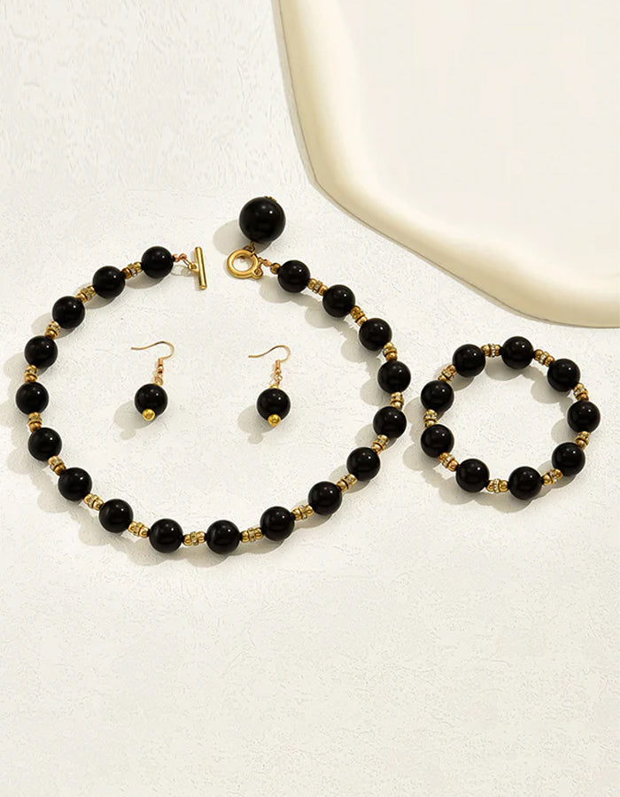 Perlmutt-Schmuckset bestehend aus Ohrringen, Halskette und Armband