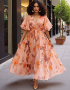 Robe longue en mousseline à imprimé floral aquarelle rose, col en V et manches à volants avec lien à nouer