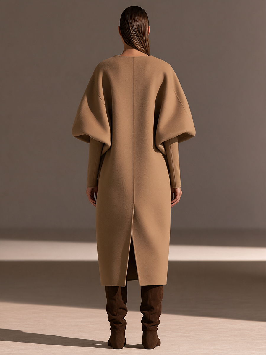 Abrigo largo de lana camel con solapa oversize, mangas abullonadas y cinturón