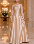 Vestido largo de satén champán con mangas de farol transparentes y cuello barco