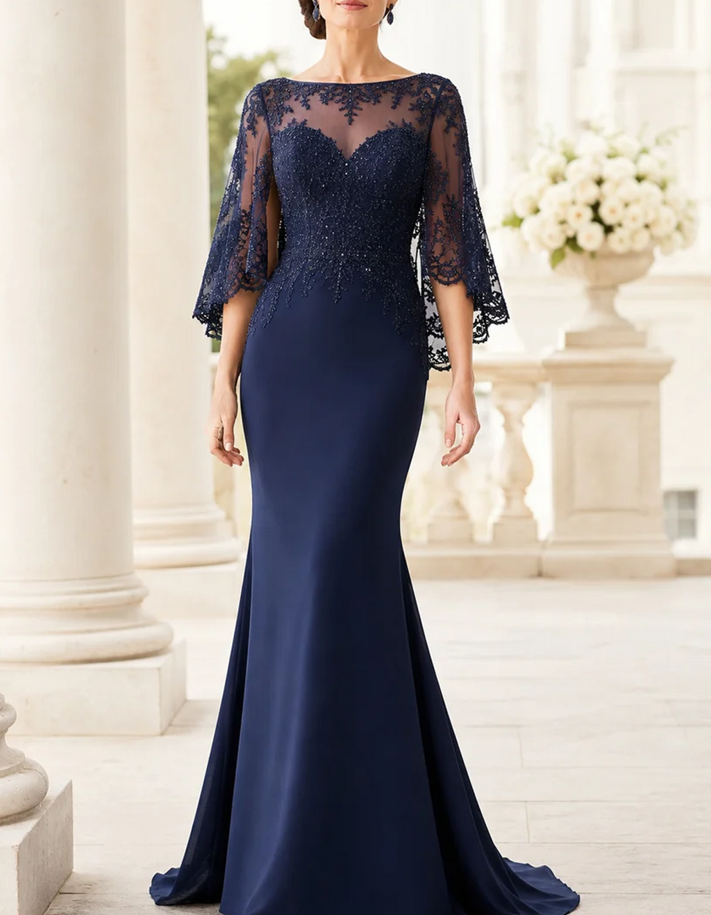 Vestido largo de encaje con cuello barco y mangas tipo capa