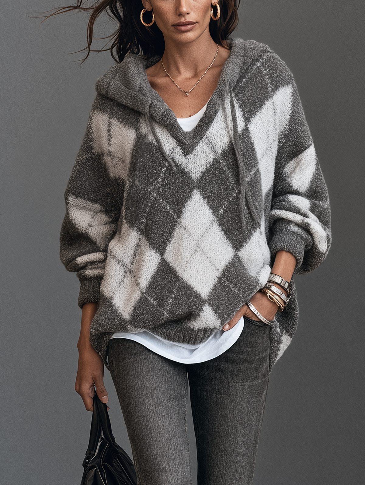 Jersey de punto gris y blanco con capucha