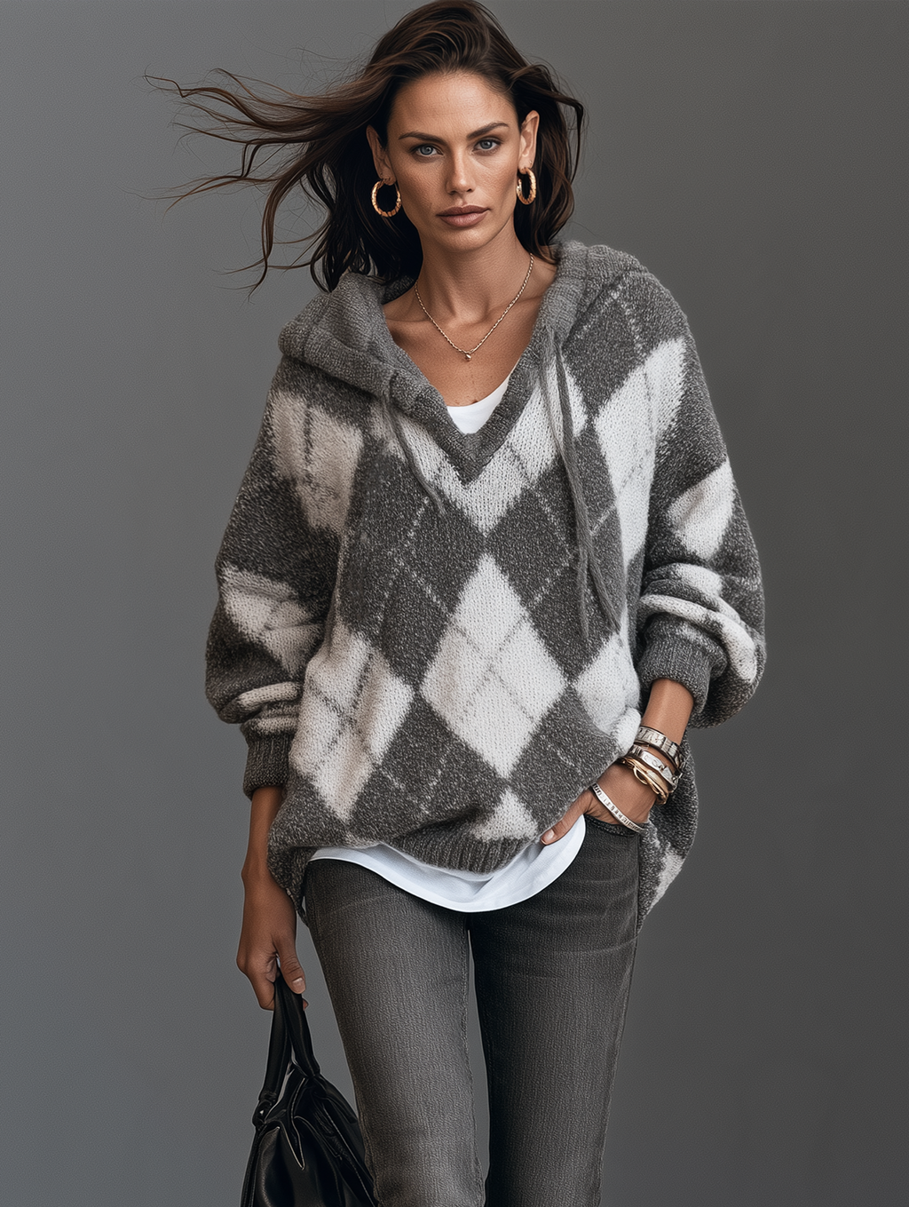 Jersey de punto gris y blanco con capucha