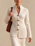 Top largo de canalé con cuello alzado y trencas