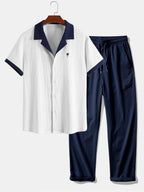 Wrinkled shirt with contrast palm tree embroidery and crinkled straight-leg trousers