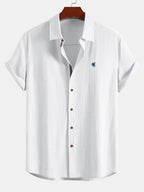 Short-sleeved button-up shirt with a linen look