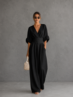 Elegante mono holgado de cuello en V y talle alto.