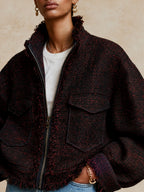 Chaqueta corta de tweed con cuello alzado y bordes deshilachados