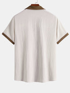 Camisa arrugada con bordado de palmeras en contraste
