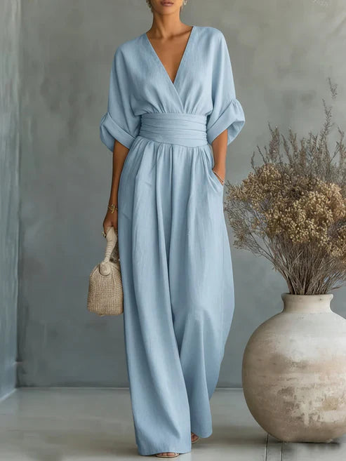 Elegant V-neck high-waisted loose-fit jumpsuit.