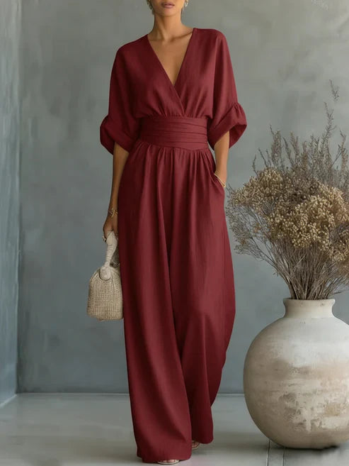 Elegant V-neck high-waisted loose-fit jumpsuit.