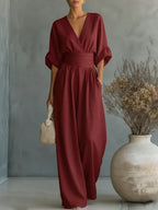 Elegant V-neck high-waisted loose-fit jumpsuit.