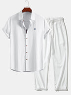 Short-sleeve button-up shirt in a linen-look fabric, and straight trousers with a crinkled texture