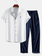 Short-sleeve button-up shirt in a linen-look fabric, and straight trousers with a crinkled texture