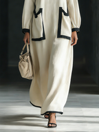 Vestido largo de algodón y lino beige con ribete negro y bolsillos