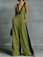 Women's wide-leg jumpsuit with V-neck and contrast trim.
