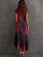 Vestido largo cruzado con estampado abstracto