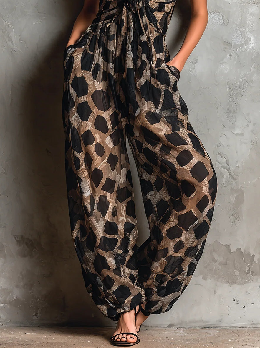 Loose-fitting animal print halter neck jumpsuit in black, with a wide leg