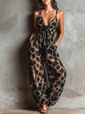 Loose-fitting animal print halter neck jumpsuit in black, with a wide leg