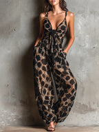 Loose-fitting animal print halter neck jumpsuit in black, with a wide leg
