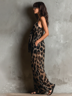 Loose-fitting animal print halter neck jumpsuit in black, with a wide leg