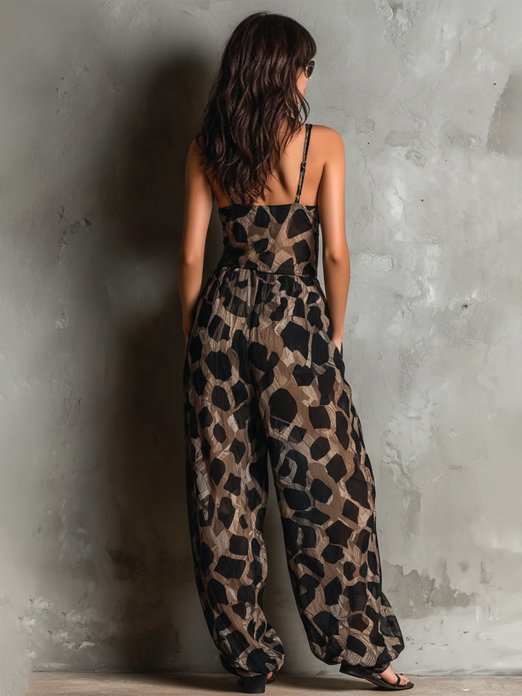 Loose-fitting animal print halter neck jumpsuit in black, with a wide leg