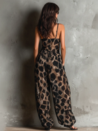 Loose-fitting animal print halter neck jumpsuit in black, with a wide leg