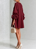 Minivestido con estampado floral y botones, con llamativos puños florales.