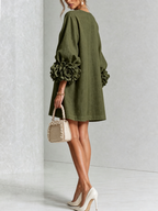 Minivestido con estampado floral y botones, con llamativos puños florales.