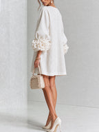 Minivestido con estampado floral y botones, con llamativos puños florales.
