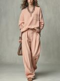 Dusty pink set with a crew-neck sweatshirt and high-waisted wide-leg trousers
