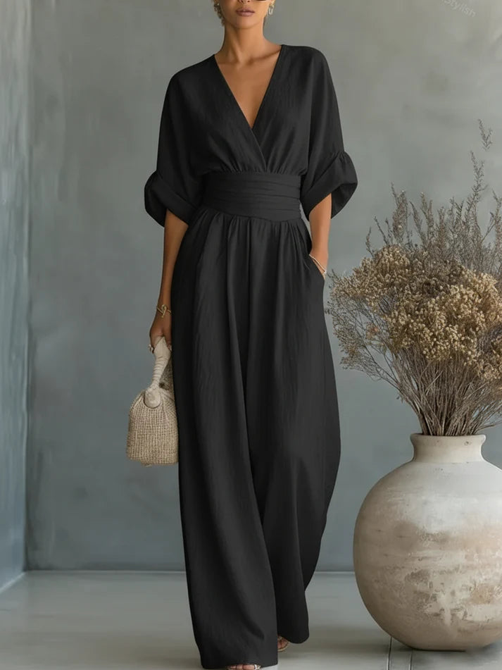Elegante mono holgado de cuello en V y talle alto.