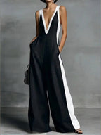 Women's wide-leg jumpsuit with V-neck and contrast trim.
