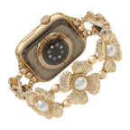 Correa elástica Apple Watch para mujer, con flores metálicas y perlas nacaradas, elegante accesorio de muñeca, modelo Sumeria