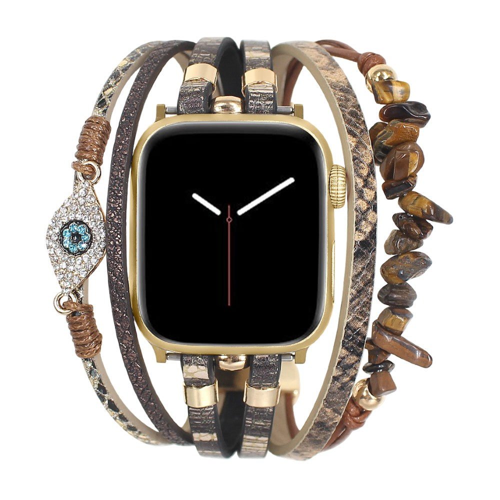 Correa Apple Watch elegante, tiras finas de material sintético, piedras decorativas marrones, dije de ojo protector brillante, modelo Mercuria