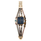 Correa Apple Watch elegante, tiras finas de material sintético, piedras decorativas marrones, dije de ojo protector brillante, modelo Mercuria