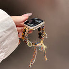 Correa Apple Watch de Ojo de Tigre natural, cordón trenzado multicolor, charms dorados, modelo Tenzin