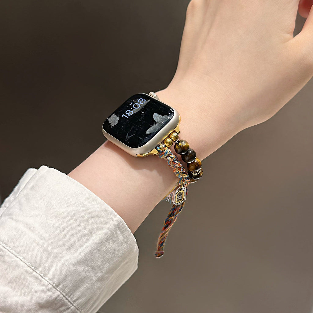 Correa Apple Watch de Ojo de Tigre natural, cordón trenzado multicolor, charms dorados, modelo Tenzin