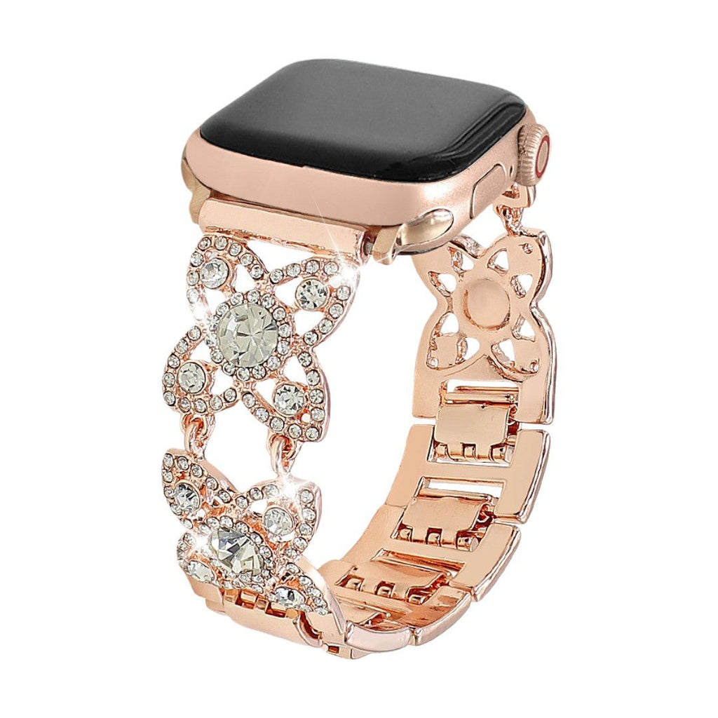 Correa Apple Watch para mujer de metal, motivo de tréboles engastados con circonitas brillantes, malla fantasía elegante, modelo Yadna