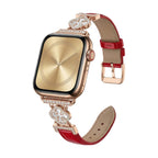 Correa Apple Watch para mujer en material sintético charolado, motivo trébol pavé de circonitas, aleación dorada elegante, modelo Circé