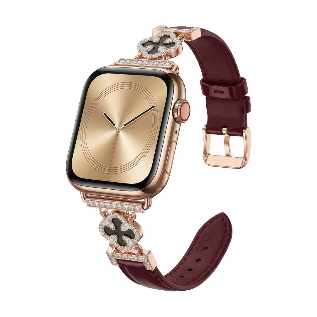Correa Apple Watch para mujer en material sintético charolado, motivo trébol pavé de circonitas, aleación dorada elegante, modelo Circé