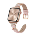 Correa Apple Watch para mujer en material sintético charolado, motivo trébol pavé de circonitas, aleación dorada elegante, modelo Circé