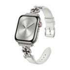 Correa Apple Watch para mujer en material sintético charolado, motivo trébol pavé de circonitas, aleación dorada elegante, modelo Circé