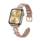 Correa Apple Watch para mujer en material sintético charolado, motivo trébol pavé de circonitas, aleación dorada elegante, modelo Circé