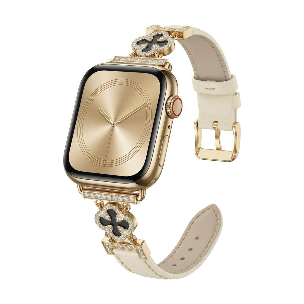 Correa Apple Watch para mujer en material sintético charolado, motivo trébol pavé de circonitas, aleación dorada elegante, modelo Circé